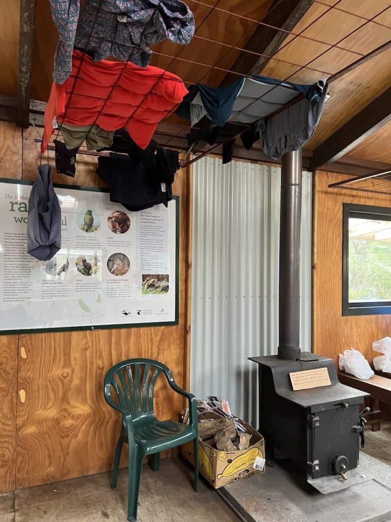 Drying rack and fireplace in the first of the Milford Track huts