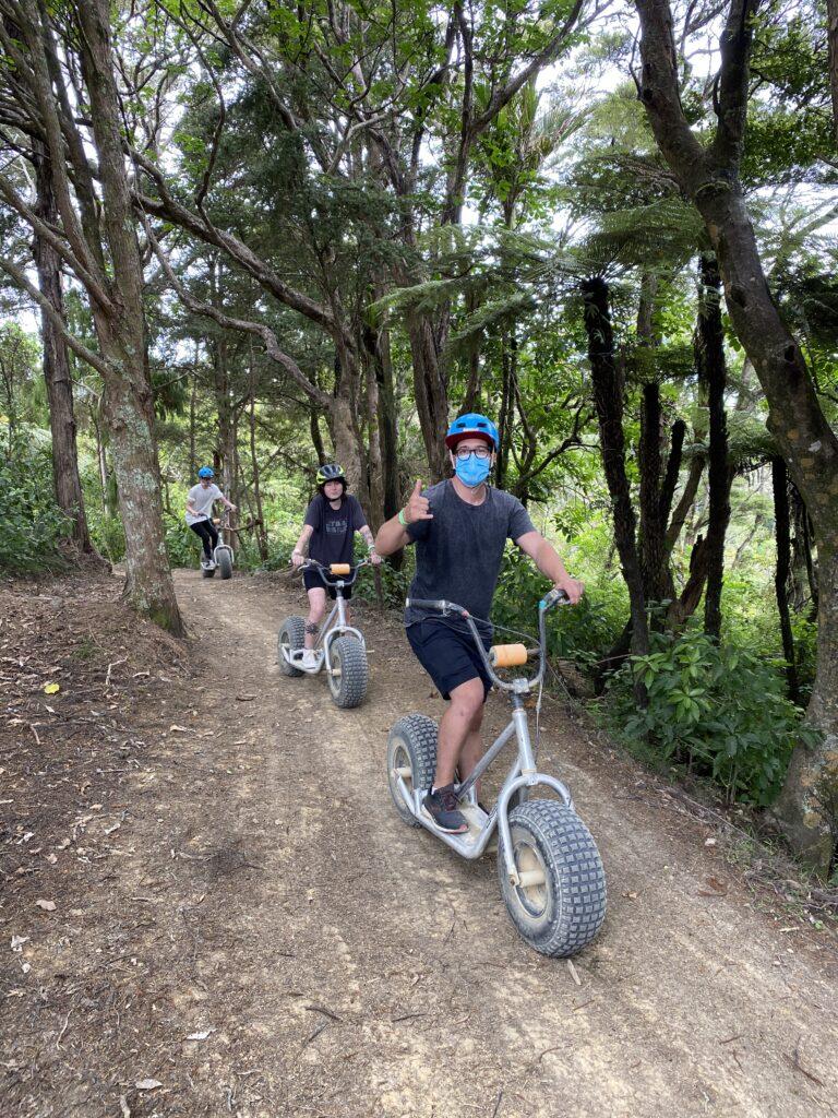 Off-road electric scooters on a forest path, one of the best active things to do in Whangarei