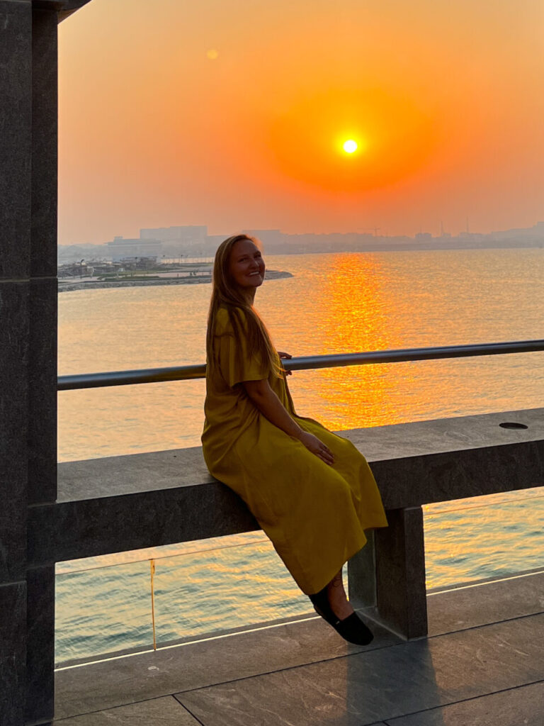 Girl in a yellow dress at sunset