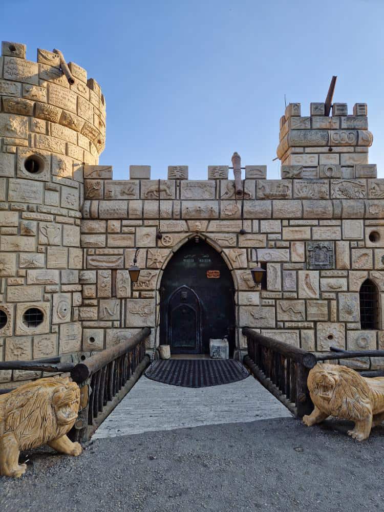 castle-like building with lion statutes