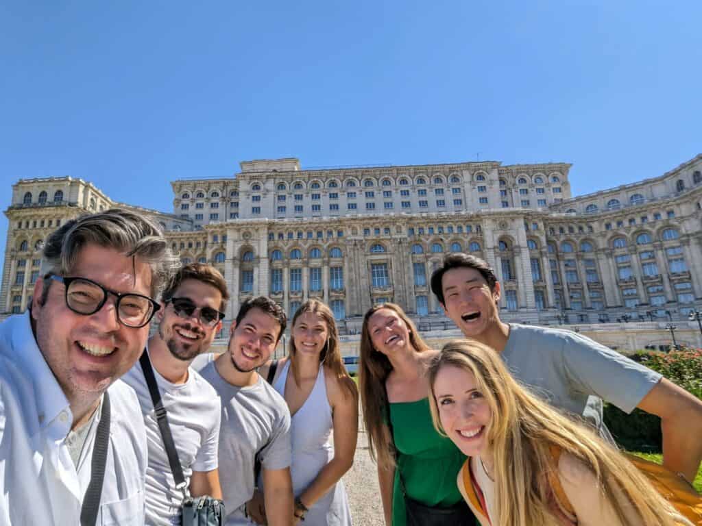 Friends in front of the Palace of Parliament in Bucharest