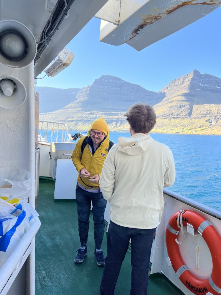 Two people laughing on a boat where are the faroe islands