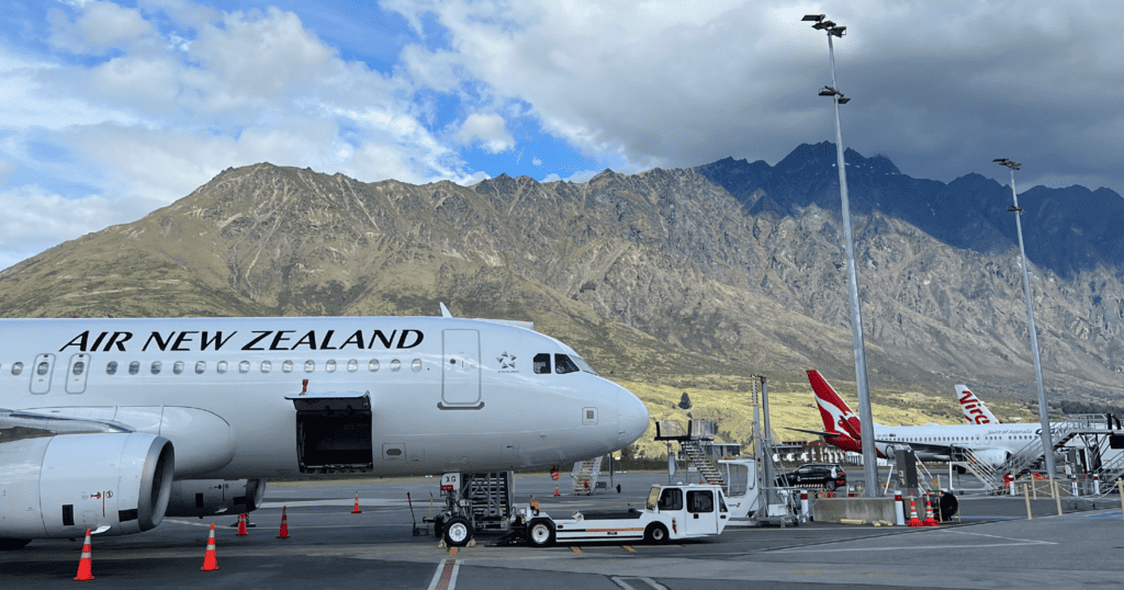 Air New Zealand plane against mountains explore New Zealand