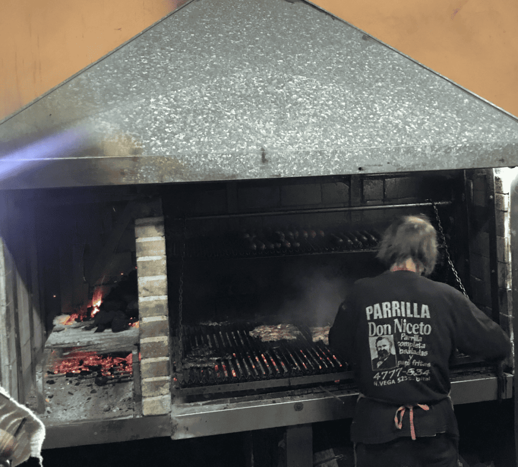 Man cooking parillas