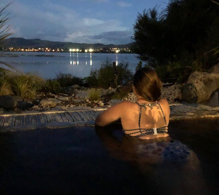 Girl looking out over the lake from the Polynesian spa in Rotorua