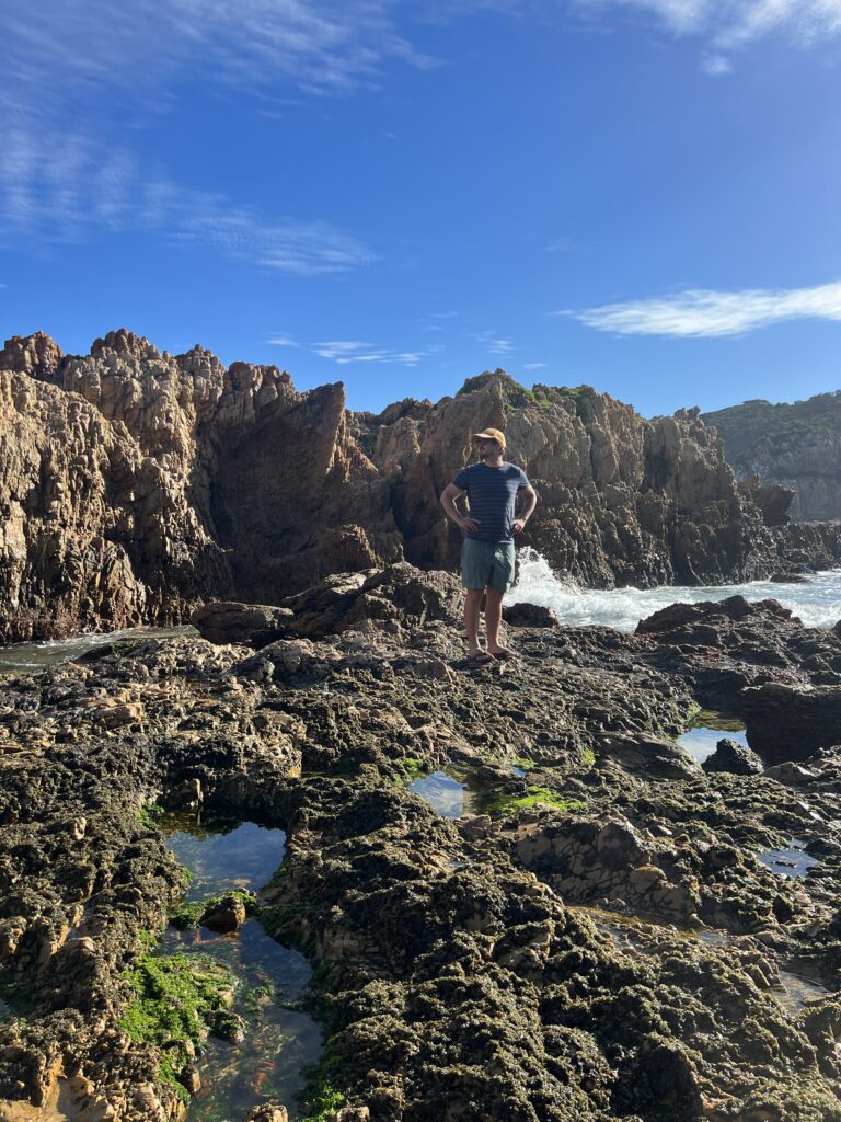 Man on Knysna rocky shore