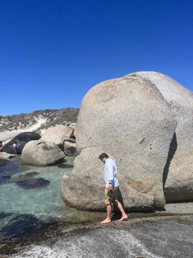 Man walking on a rocky beach