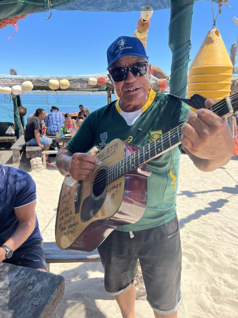 Man with Guitar at Die Strandloper