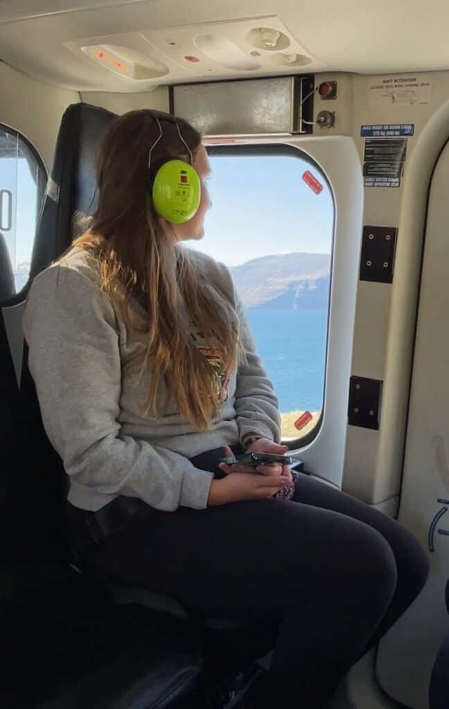 Girl sitting inside helicopter