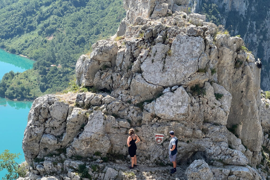 two people about to climb a rock