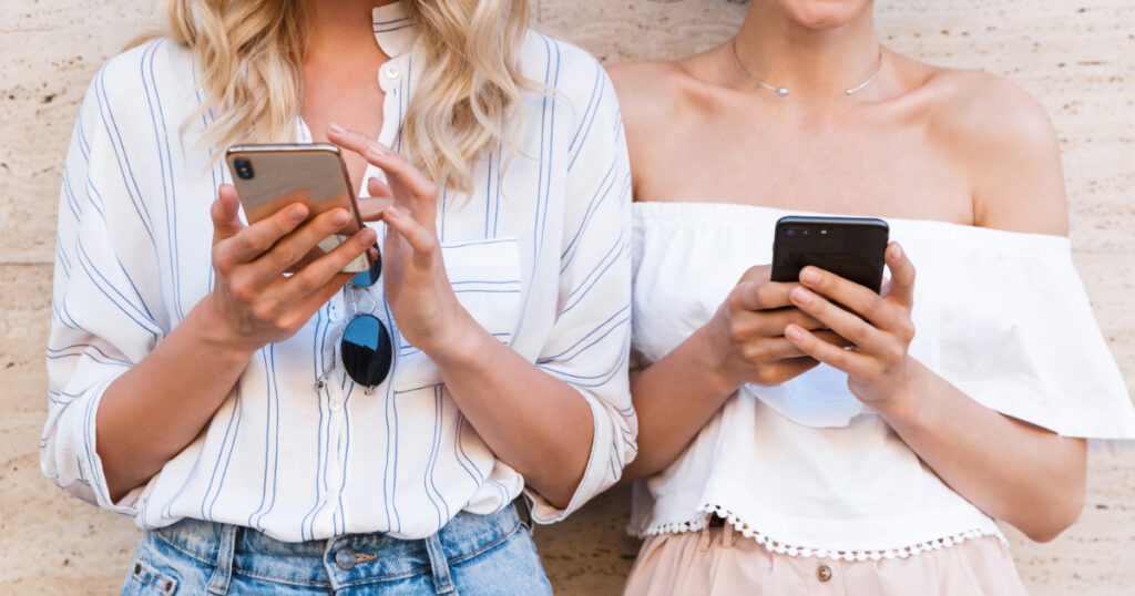 two women using Holafly vs. Airalo eSIM