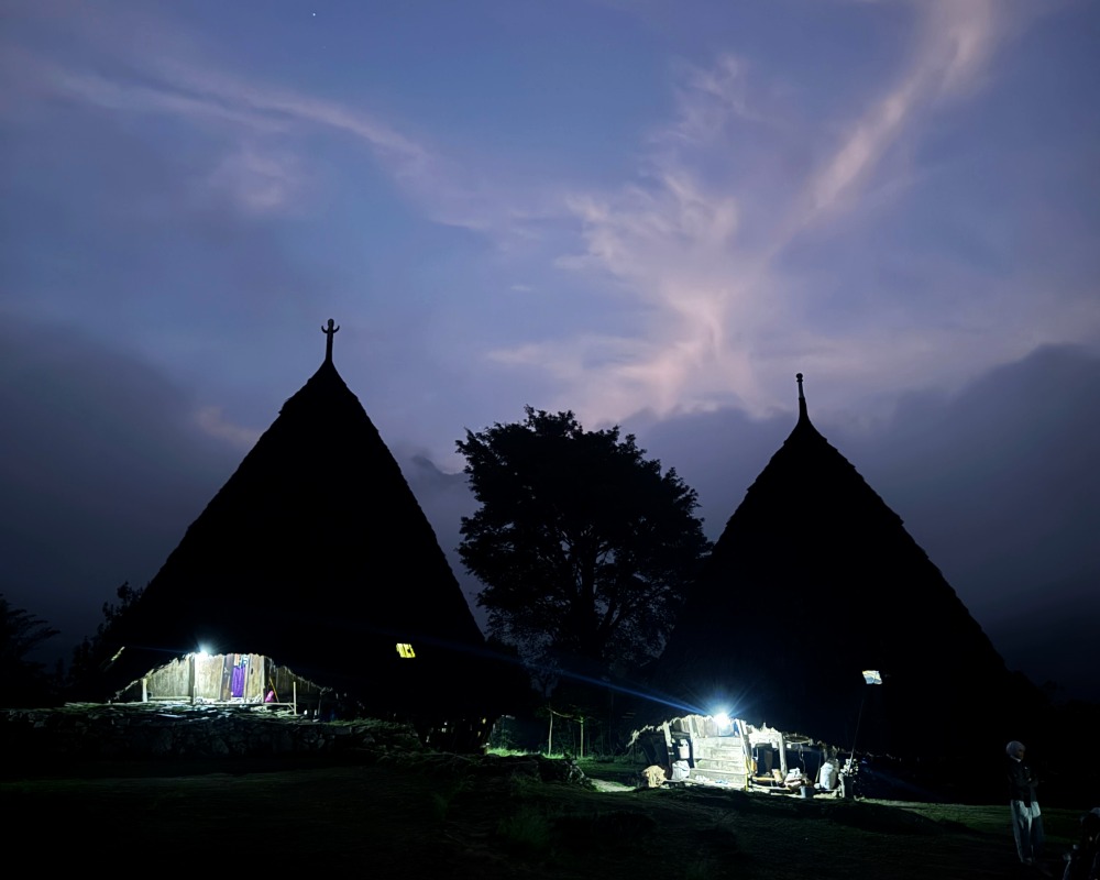 Wae Rebo with purple starry skies