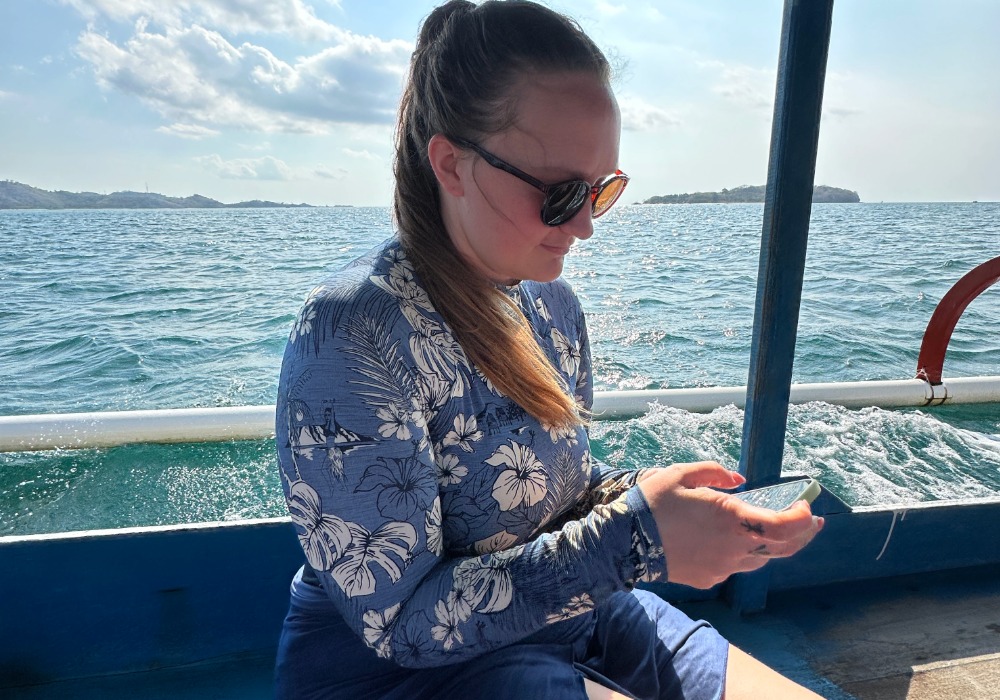 Me using an Holafly eSIM on a boat