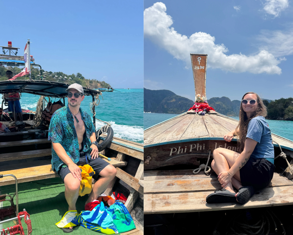 Two travelers sit on wooden longtail boats in clear turquoise water near Phi Phi Islands, wearing summer clothes and hats with bags and towels on deck.