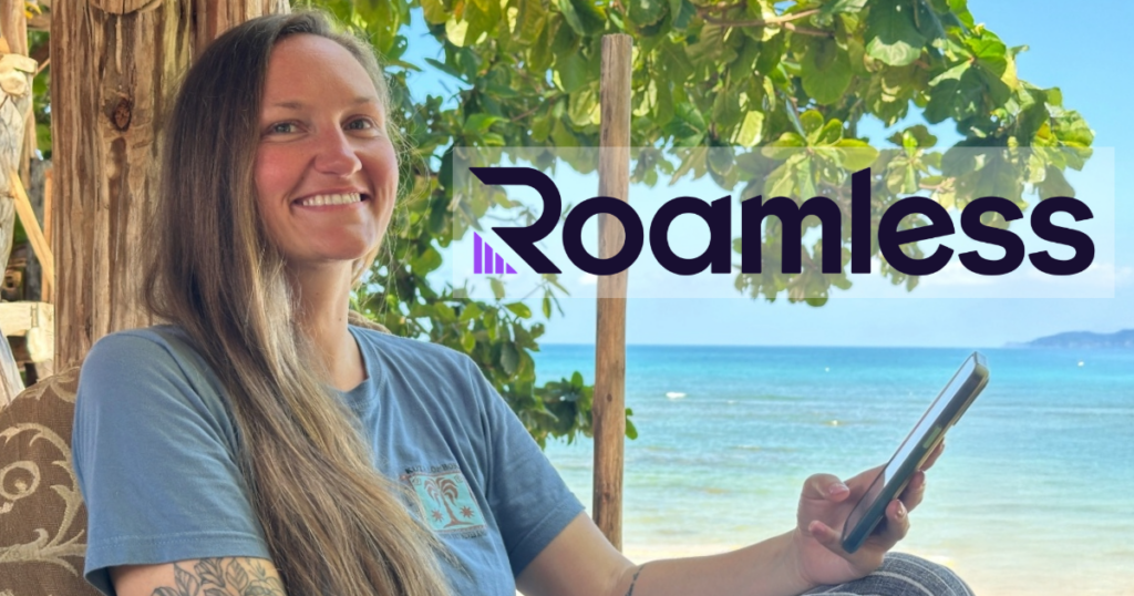 Woman using an eSIM on the beach