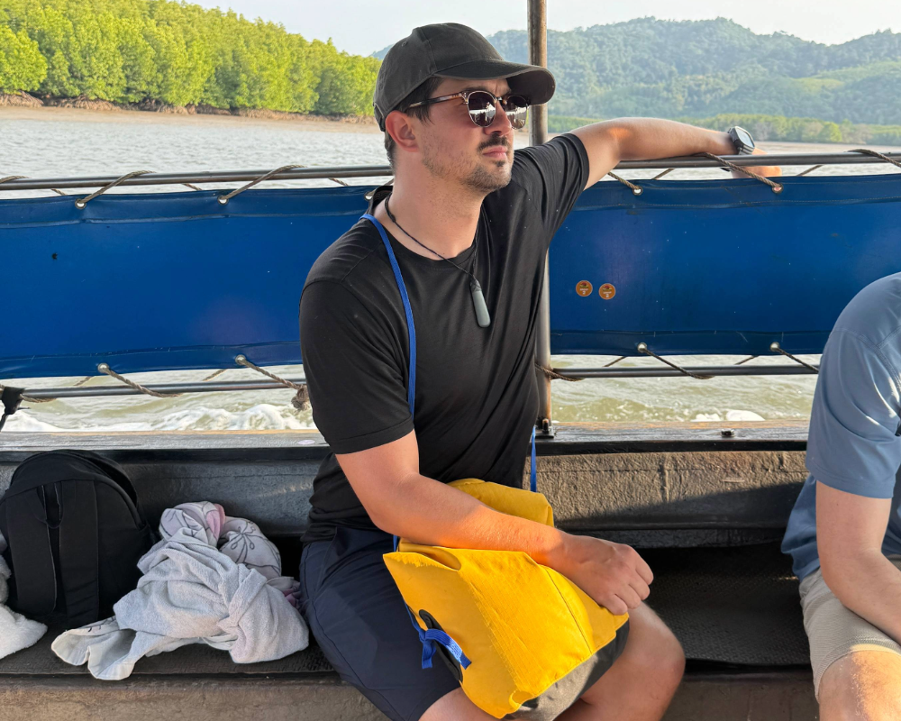 man on a boat with a drybag