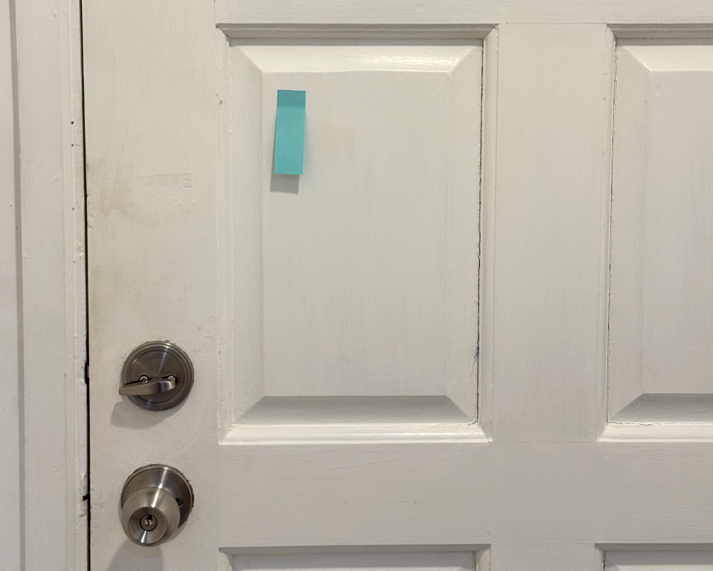 post it on the back of a hotel door, a top long term travel packing tip