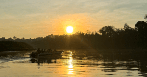 Kinabatangan River Cruise boat at sunset