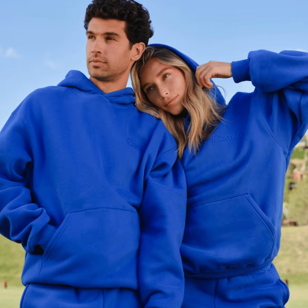 Couple in matching blue Comfrt hoodies