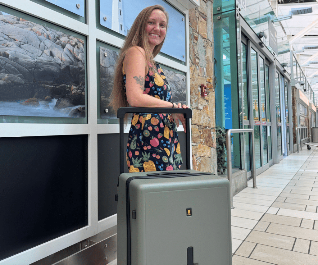 Woman with level8 suitcase at YVR airport