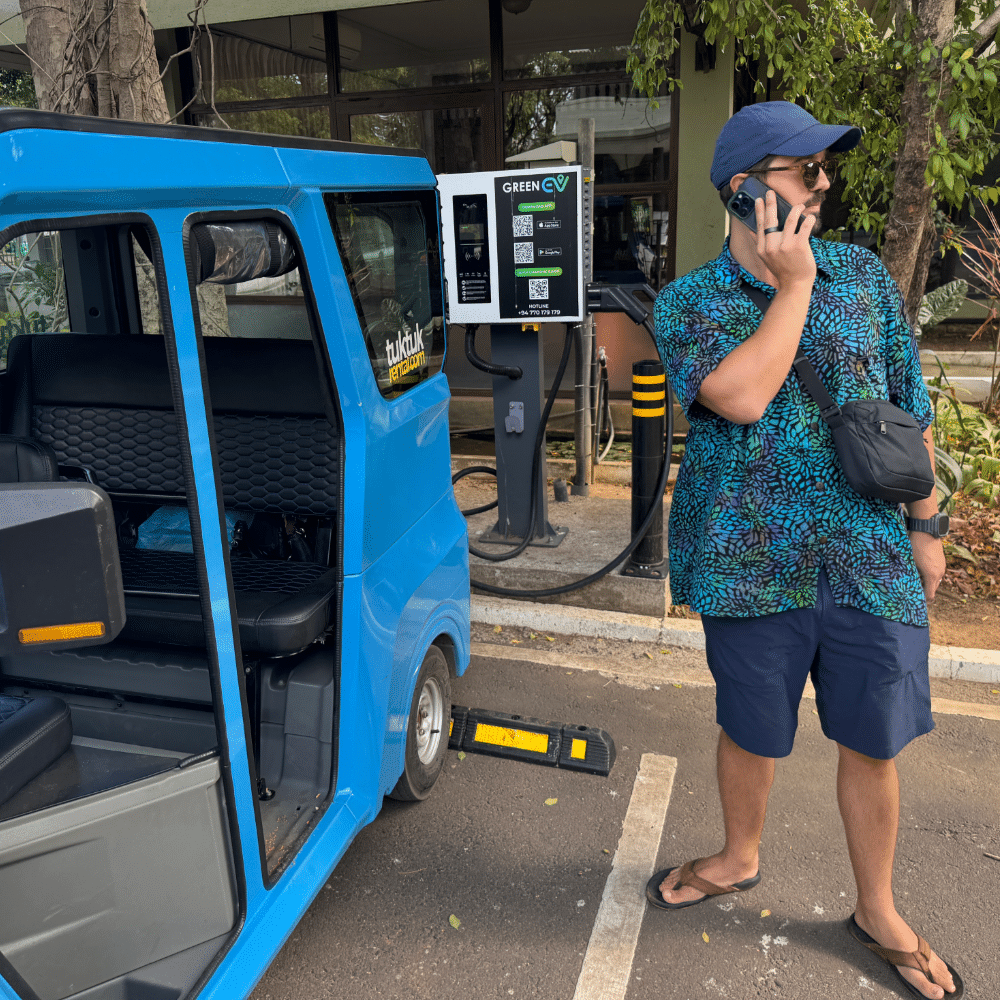 Calling for help at a tuk tuk electric charging station