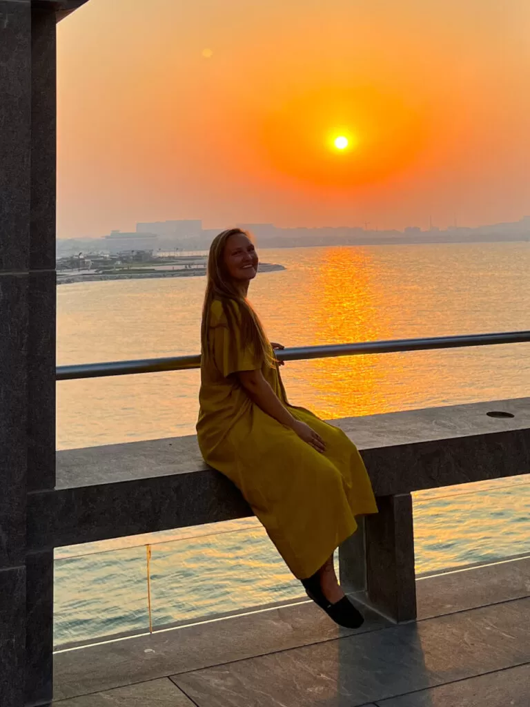 Girl in a yellow dress at sunset